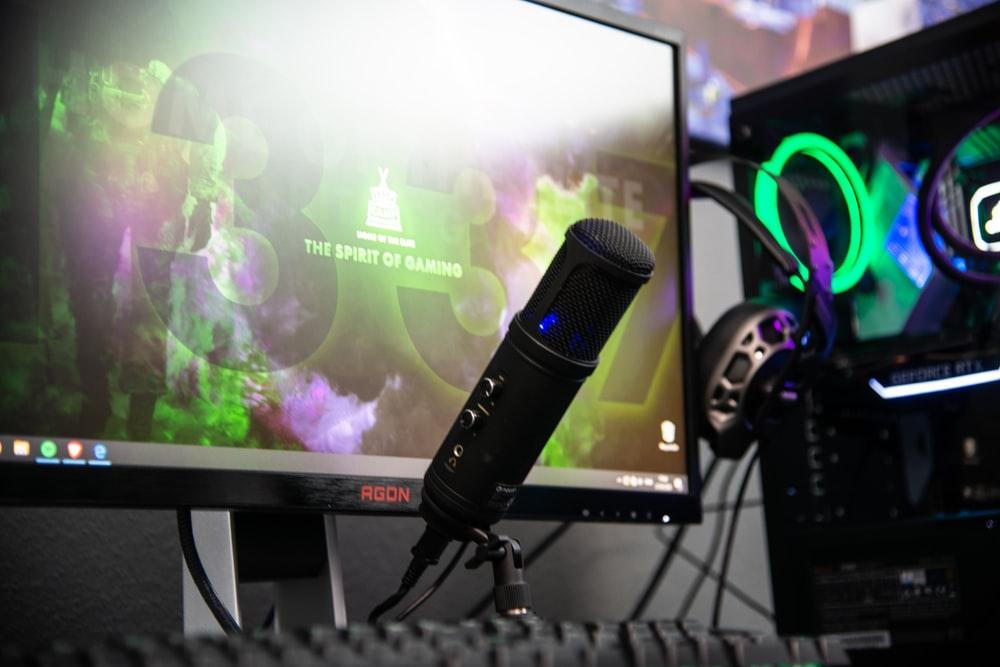 black-microphone-beside-black-flat-screen-computer black microphone beside black flat screen computer monitor